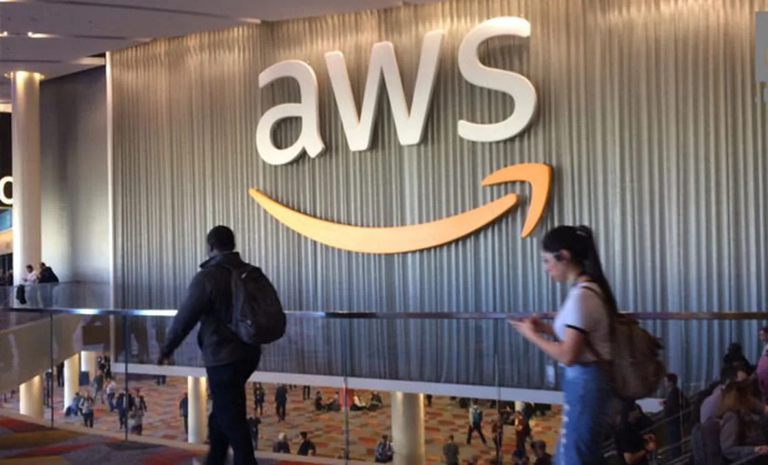 AWS logo on the wall of a conference venue