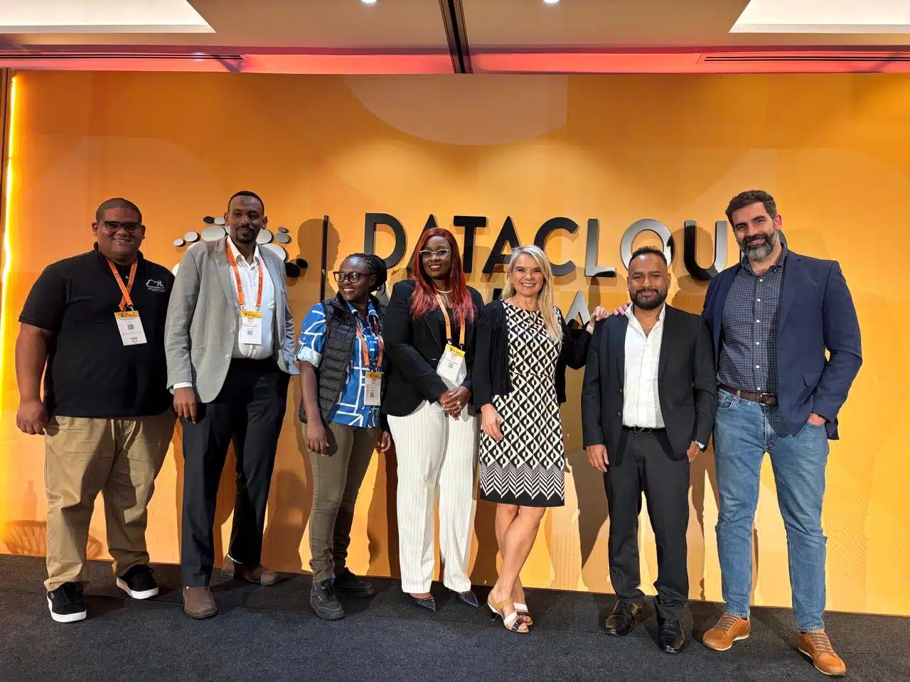 Delegates photographed in front of the Datacloud Africa stage backdrop in Nairobi
