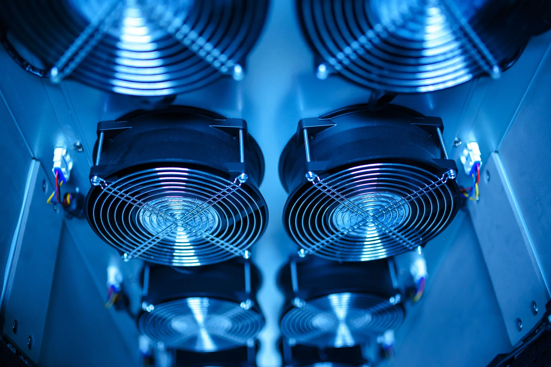 Industrial cooling units and pipework inside a data centre plant room