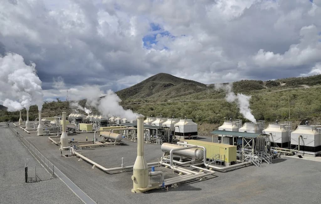 Steam pipelines and cooling towers at the Olkaria geothermal complex in Naivasha