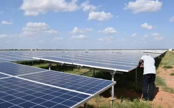 Technician installing solar panels
