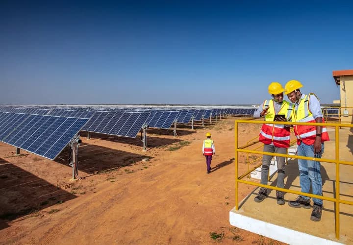 Workers at a large solar farm in Kenya