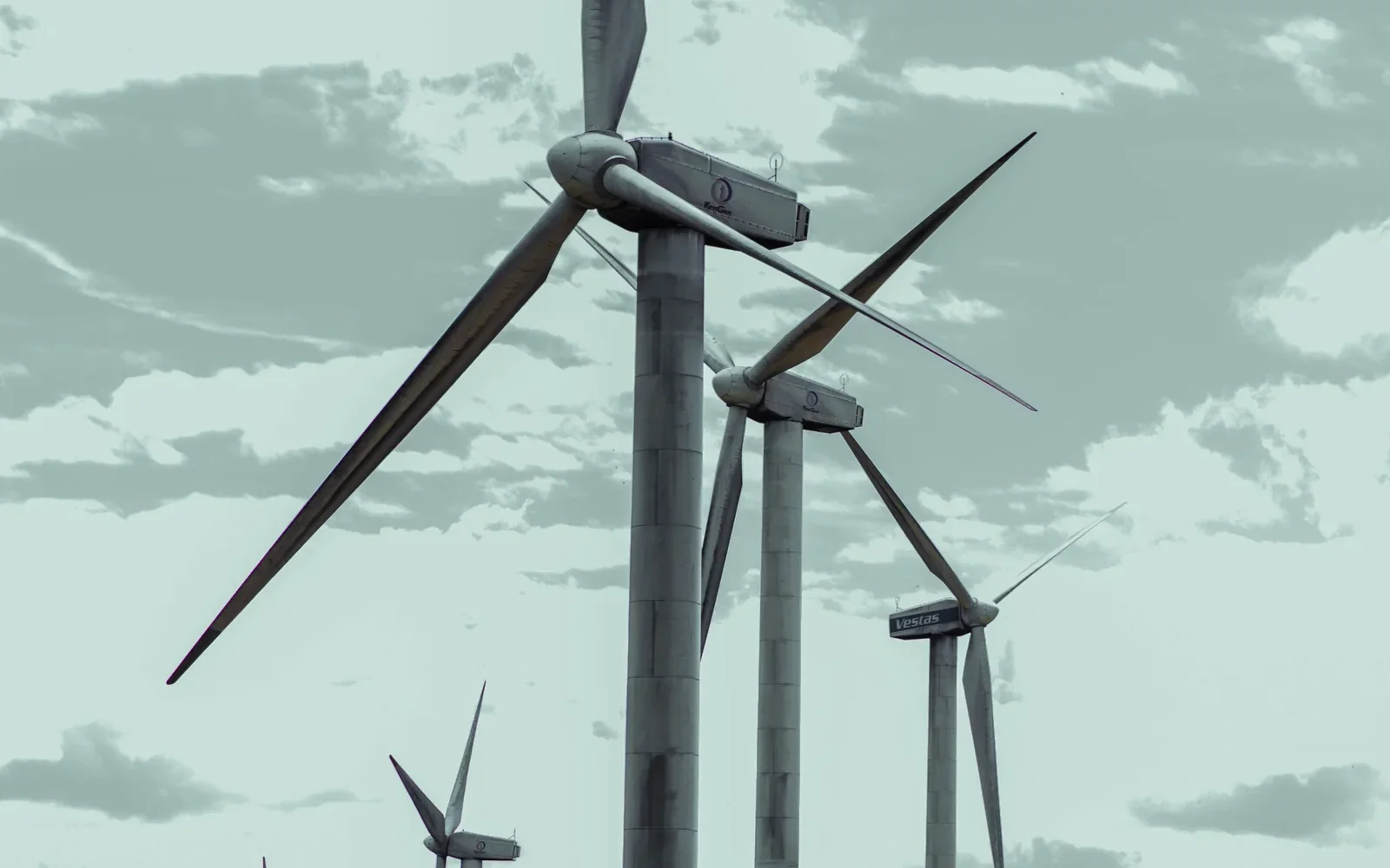Wind turbines turning across a Kenyan landscape